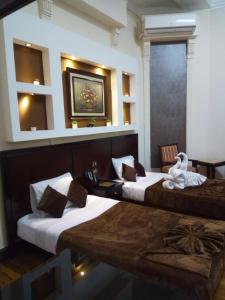 開羅的住宿－Paradise Boutique Hotel，酒店的客房内设有两张床,房间设有: