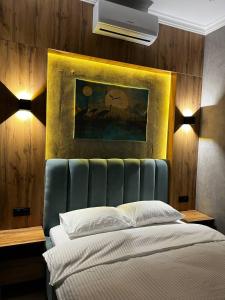 Ein Bett oder Betten in einem Zimmer der Unterkunft Sunrise Hotel