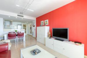 Televízia a/alebo spoločenská miestnosť v ubytovaní Mileni Atico Duplex Roses - Immo Barneda