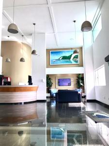 Et tv og/eller underholdning på Flat Ponta Negra vista para o mar