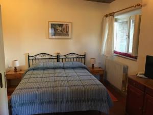 Un pat sau paturi într-o cameră la CasaLeTolfe Residence
