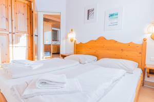 Posteľ alebo postele v izbe v ubytovaní Gerlitzen Berg- und Seenurlaub