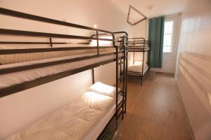 Postel nebo postele na pokoji v ubytování Le Flâneur Guesthouse
