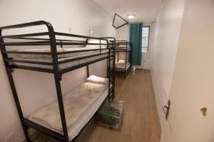 Postel nebo postele na pokoji v ubytování Le Flâneur Guesthouse