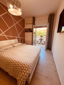 En eller flere senge i et værelse på l'alba sullo jonio