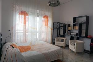 En eller flere senge i et værelse på Viva la Nonna