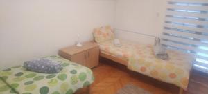 Ένα ή περισσότερα κρεβάτια σε δωμάτιο στο Apartman Lazovic
