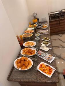 a buffet with many plates of food on a table at Petra Premium Hotel in Wadi Musa