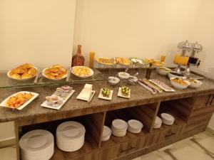 a buffet with many different types of food on it at Petra Premium Hotel in Wadi Musa