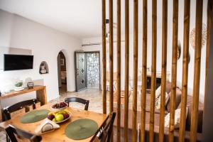 a dog is sitting at a table in a room at Gifel - Luxury apartment in Kalamaki Heraklion