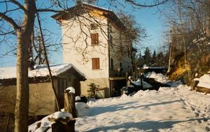 a large building with snow on the ground at Casa di campagna in Marola