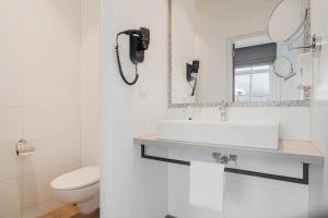 Baðherbergi á Hotel Maassluis