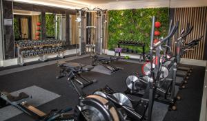 a gym with several exercise bikes in a room at The Quay Hotel and Spa in Conwy