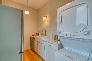 a white kitchen with a sink and a refrigerator at The 4M Favorite House - Stunning & Spotless Studio Apt (#2) in Ann Arbor