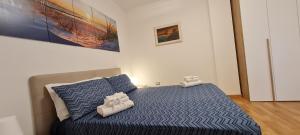 A bed or beds in a room at Gruppo Aedes Alghero, Residenza L'Isola - 200 mt dalla spiaggia