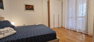 A bed or beds in a room at Gruppo Aedes Alghero, Residenza L'Isola - 200 mt dalla spiaggia