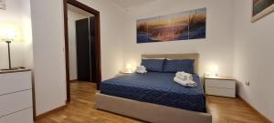 A bed or beds in a room at Gruppo Aedes Alghero, Residenza L'Isola - 200 mt dalla spiaggia