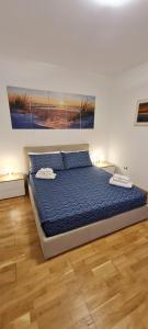 A bed or beds in a room at Gruppo Aedes Alghero, Residenza L'Isola - 200 mt dalla spiaggia