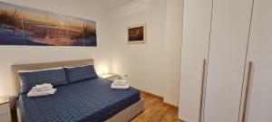 A bed or beds in a room at Gruppo Aedes Alghero, Residenza L'Isola - 200 mt dalla spiaggia