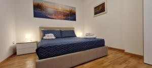 A bed or beds in a room at Gruppo Aedes Alghero, Residenza L'Isola - 200 mt dalla spiaggia
