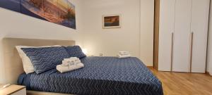 A bed or beds in a room at Gruppo Aedes Alghero, Residenza L'Isola - 200 mt dalla spiaggia