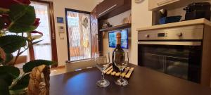 A kitchen or kitchenette at Gruppo Aedes Alghero, Residenza L'Isola - 200 mt dalla spiaggia