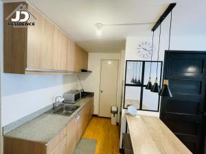 Кухня або міні-кухня у JD Residence - 1 Bedroom Unit