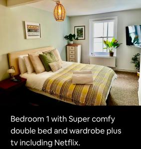 a bedroom i with super comfy bed and wardrobe plus tv including netflix at Kookaburra lodge in Brecon
