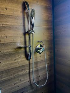 a shower in a wall with a blow dryer at Voyacasu in Villa de Leyva