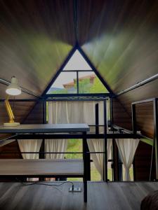 a table in a tent with a large window at Voyacasu in Villa de Leyva