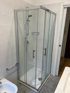 a glass shower in a bathroom with a toilet at Aurelia Antica ELLE Apartment in Rome
