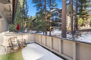 a balcony with a chair and a building at Fun & Air Conditioned Lake Tahoe 3 BR/2.5 BA Home in Incline Village