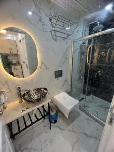 a bathroom with a sink and a shower at Ninova Boutique Hotel in Istanbul