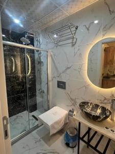 a bathroom with a shower and a sink at Ninova Boutique Hotel in Istanbul