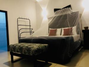 a bedroom with a bed with a canopy at Cloud Nine in Kandy