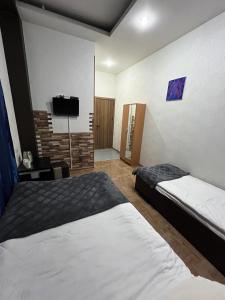 Postel nebo postele na pokoji v ubytování Hotel G&G
