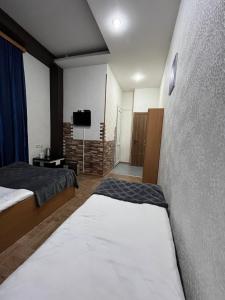 Postel nebo postele na pokoji v ubytování Hotel G&G