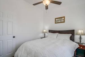 a bedroom with a bed with a ceiling fan at Entire First-Floor 3-Bedroom w Gated Yard, Laundry, Crib, Fast Wi-Fi, Private Rental, No Deposit in San Diego