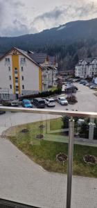 a view of a parking lot with cars parked at Apartament Czarna Góra MOON in Sienna