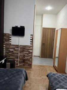 TV a/nebo společenská místnost v ubytování Hotel G&G