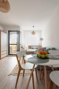a living room with a table with fruit on it at Apartment KALINA with free private parking in Plovdiv