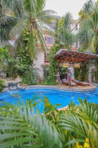 a pool at the resort at Hotel Hulku in Playa del Carmen