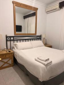 Postel nebo postele na pokoji v ubytování Hostal Playa Hidalgo
