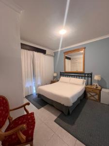 Postel nebo postele na pokoji v ubytování Hostal Playa Hidalgo