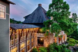 an exterior view of a large house with a tall roof at Brasstown Valley Resort & Spa in Young Harris