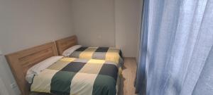 Postel nebo postele na pokoji v ubytování Villa lopez + 1 fotografie