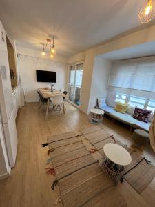 a living room with a couch and a table at Hola Hostel Alicante in Alicante