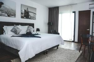 Postel nebo postele na pokoji v ubytování HOTEL MINA REAL