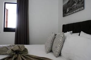 Postel nebo postele na pokoji v ubytování HOTEL MINA REAL