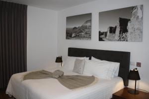 Postel nebo postele na pokoji v ubytování HOTEL MINA REAL
